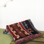 Manta con print de motivos nativo americanos